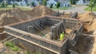 forms for new basement being set up for pouring concrete