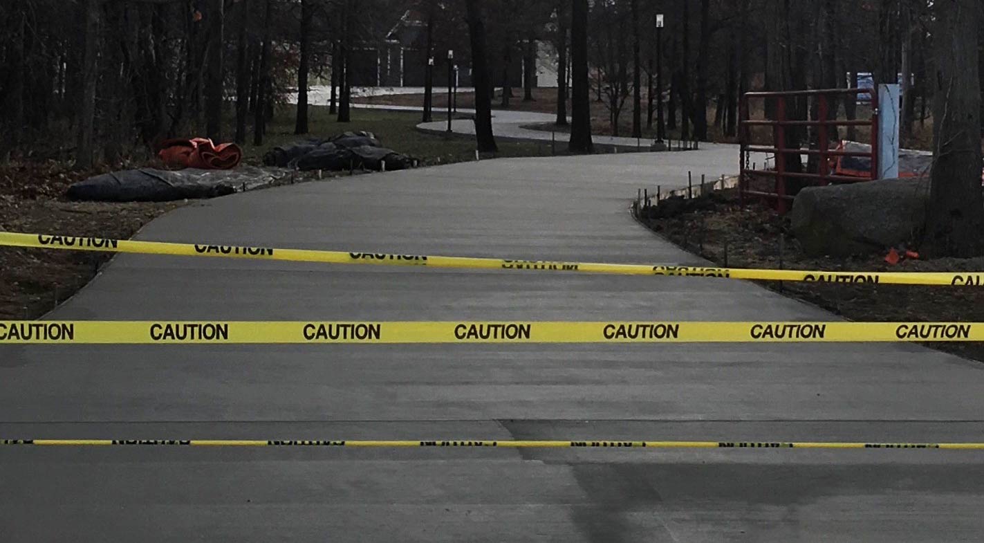 long curved driveway with fresh concrete