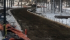 long curved driveway being poured with concrete