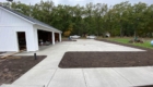 freshly poured concrete driveway and sidewalk at garage