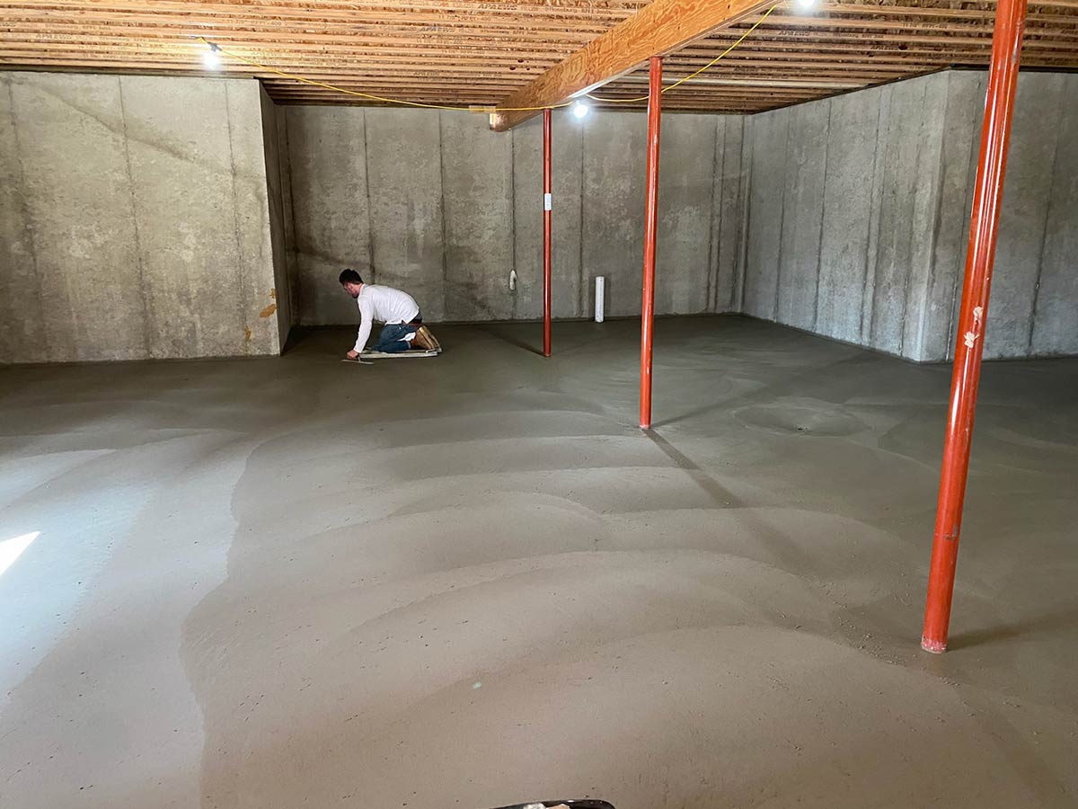 man finishing new basement floor