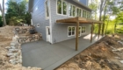 new concrete patio under deck