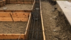 footings reinforced with rebar ready to be poured with concrete