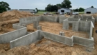 job site with new poured concrete foundation