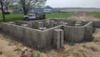 newly poured foundation at excavated job site