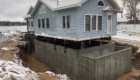 new foundation poured under raised house