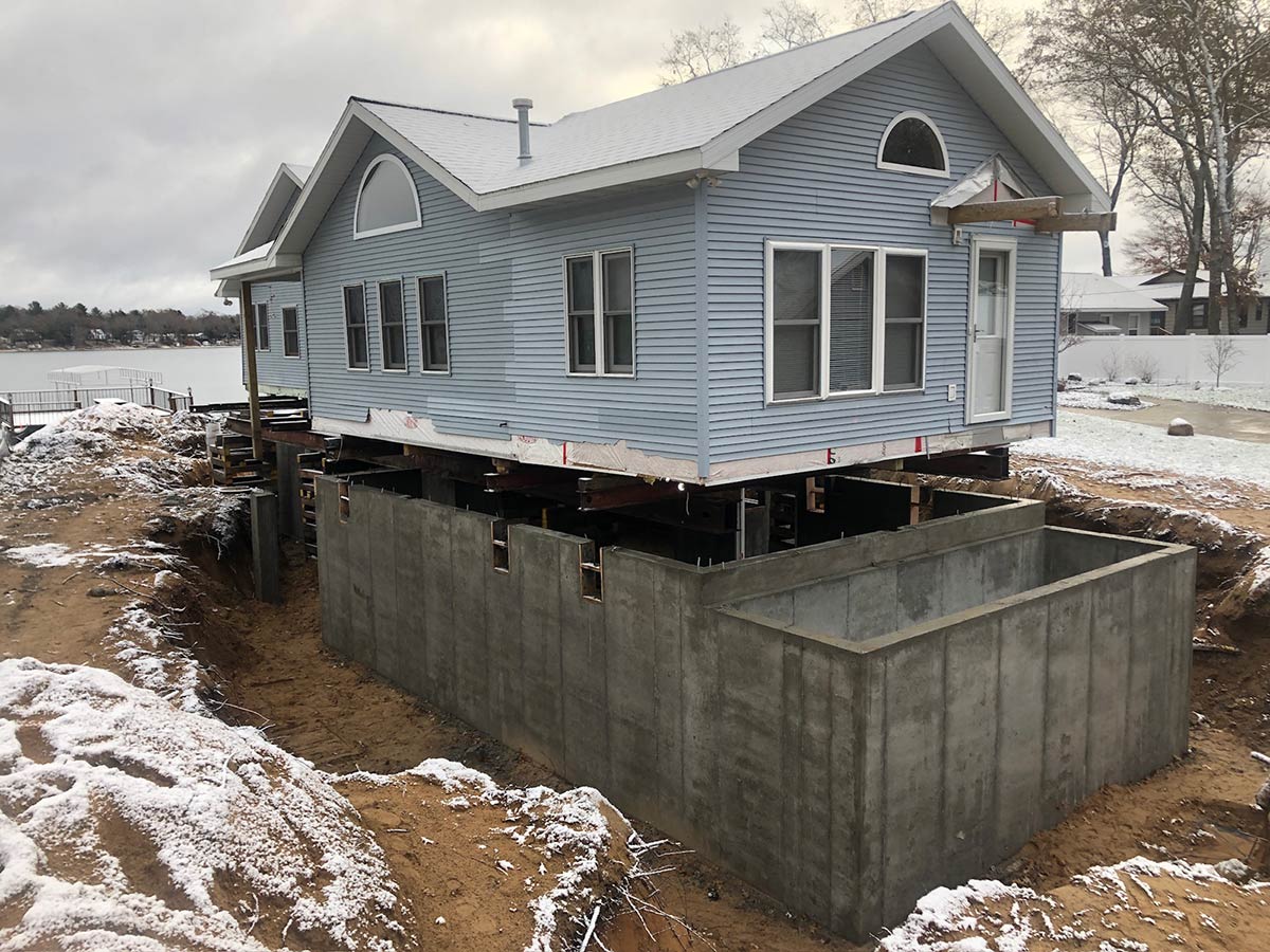 new foundation poured under raised house